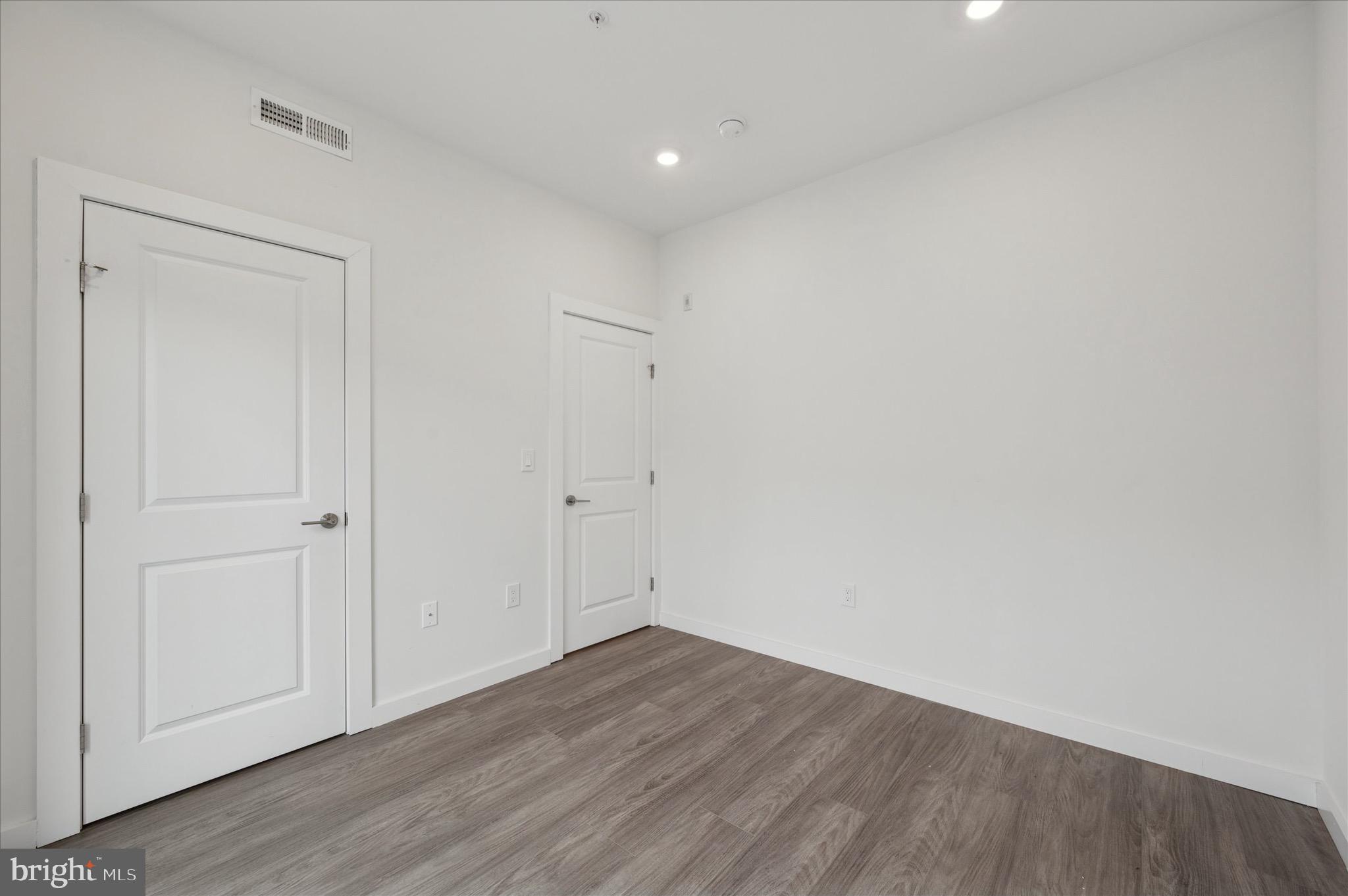 1617-19 Ridge Avenue, Unit C Philadelphia, PA 19130 - Photo 11 of 26 a view of an empty room with wooden floor
