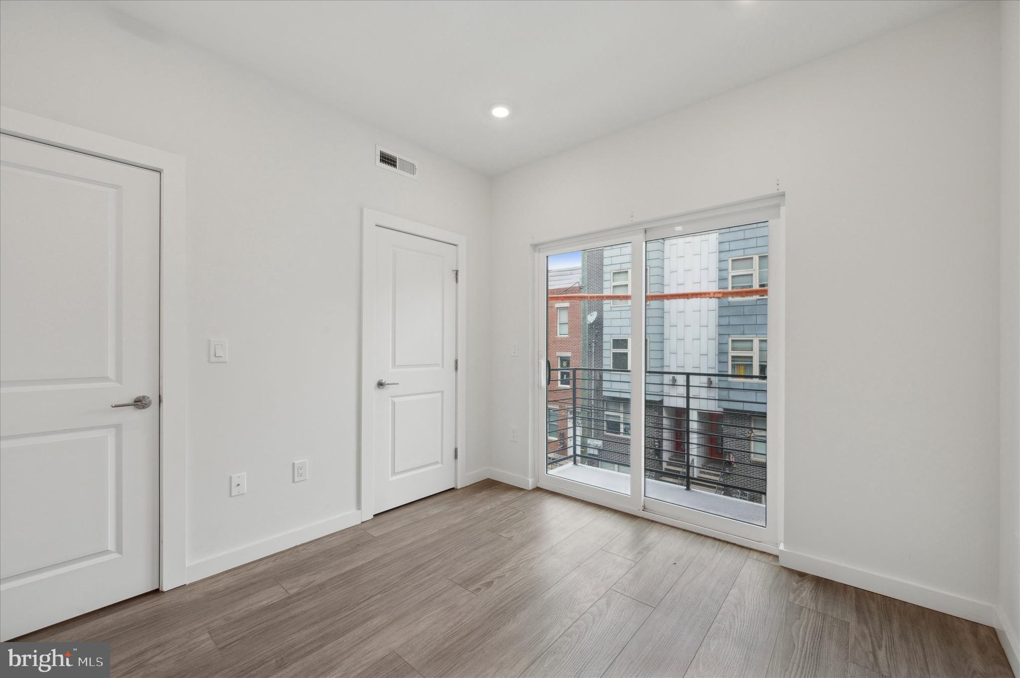 1617-19 Ridge Avenue, Unit C Philadelphia, PA 19130 - Photo 15 of 26 wooden floor in an empty room