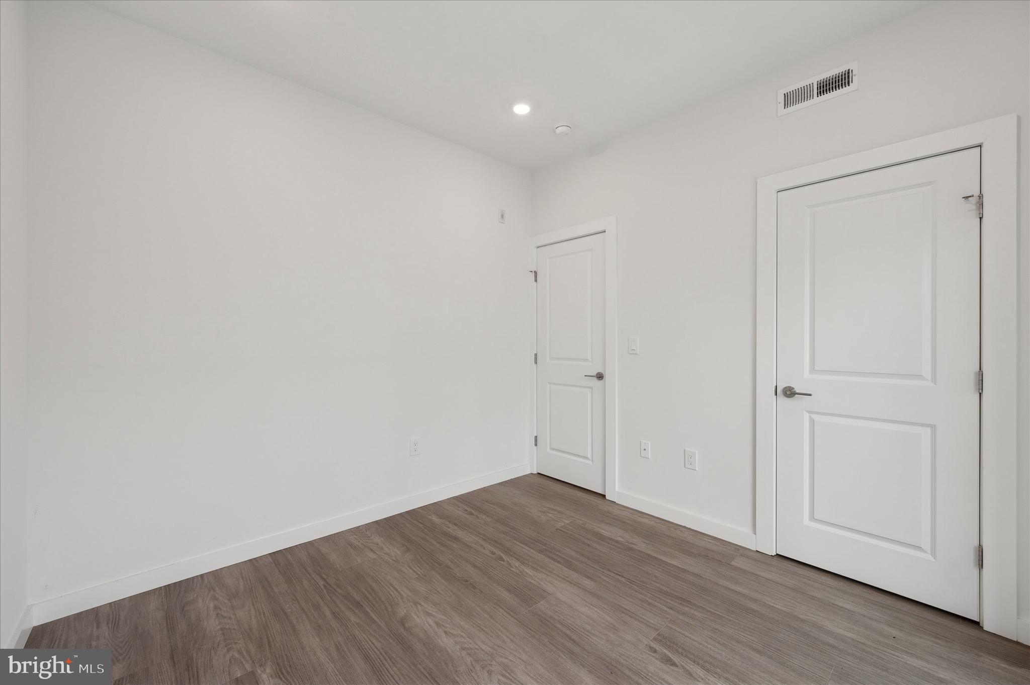 1617-19 Ridge Avenue, Unit C Philadelphia, PA 19130 - Photo 16 of 26 a view of an empty room with wooden floor