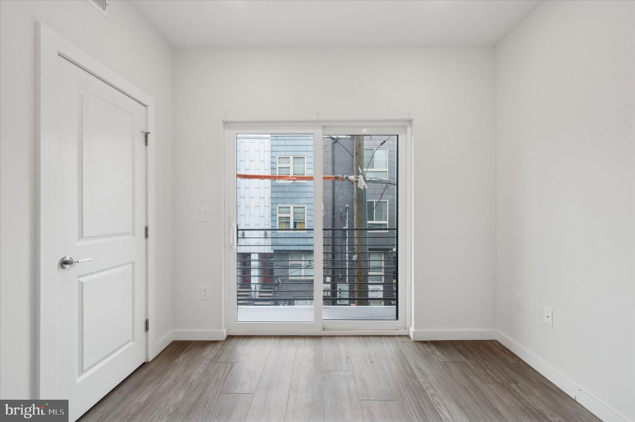 1617-19 Ridge Avenue, Unit C Philadelphia, PA 19130 - Photo 17 of 26 wooden floor in an empty room