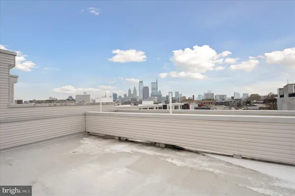 a kitchen with a refrigerator and a stove top oven