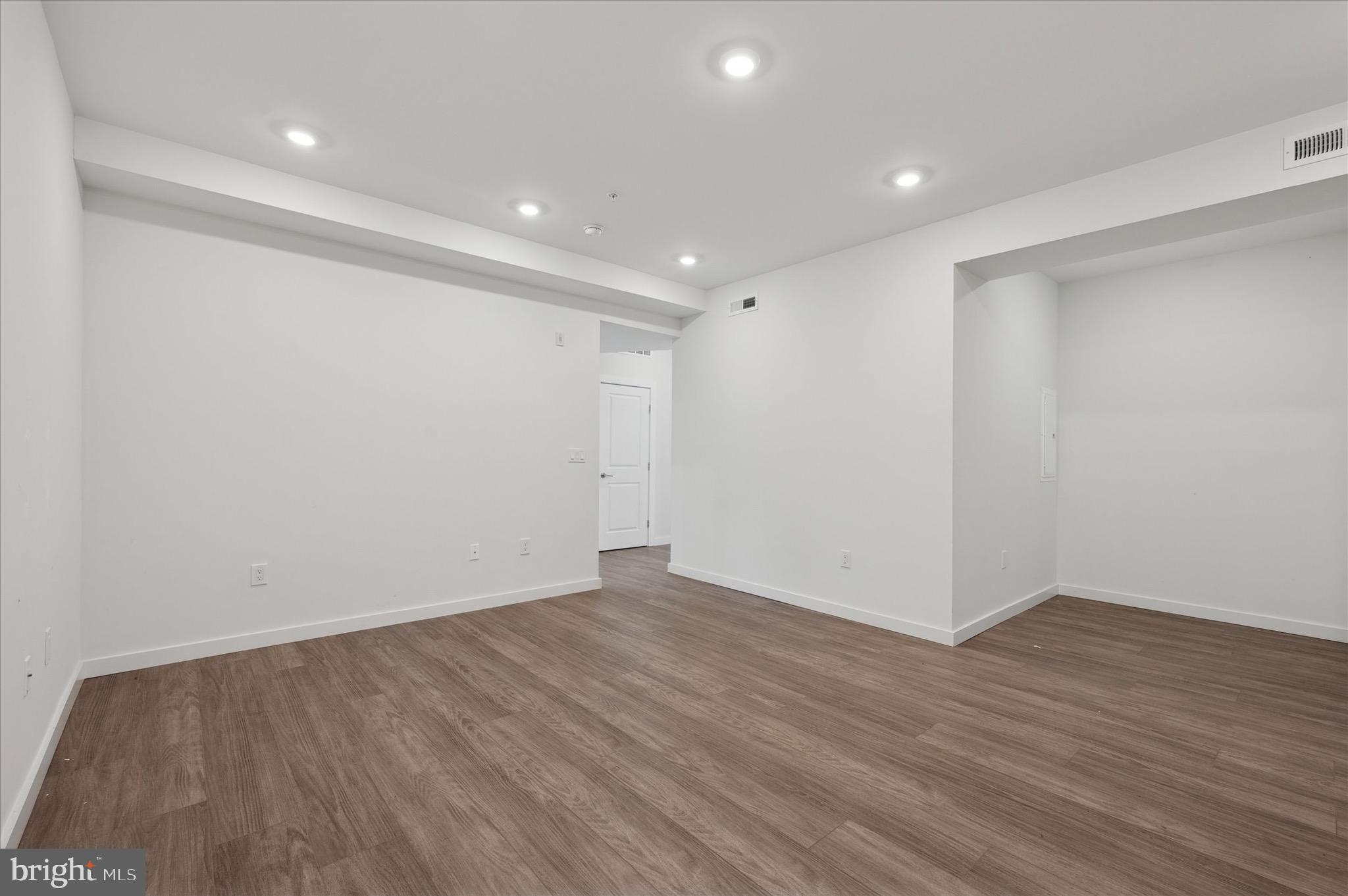 1617-19 Ridge Avenue, Unit C Philadelphia, PA 19130 - Photo 8 of 26 a view of an empty room with wooden floor