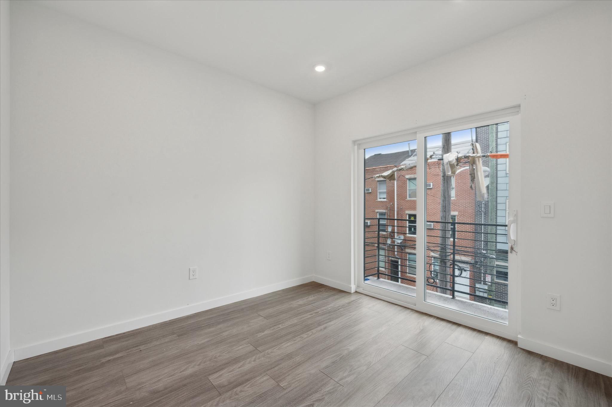 1617-19 Ridge Avenue, Unit C Philadelphia, PA 19130 - Photo 9 of 26 wooden floor in an empty room with a window
