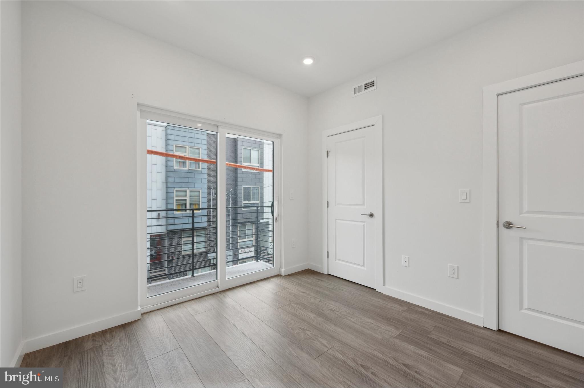1617-19 Ridge Avenue, Unit C Philadelphia, PA 19130 - Photo 10 of 26 a view of empty room with wooden floor