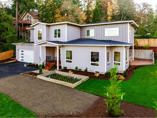 a front view of a house with a yard table and chairs