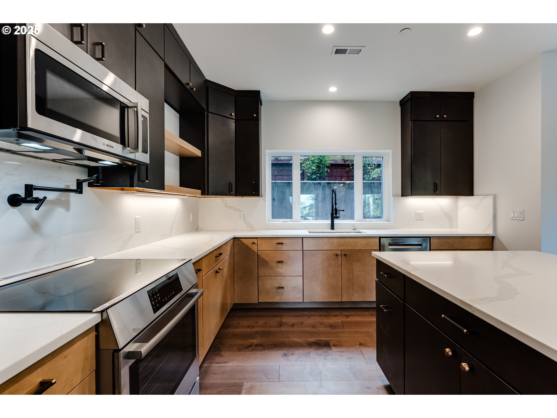 2240 West 25th Place Eugene, OR 97405 - Photo 12 of 48 a kitchen with a sink and white cabinets