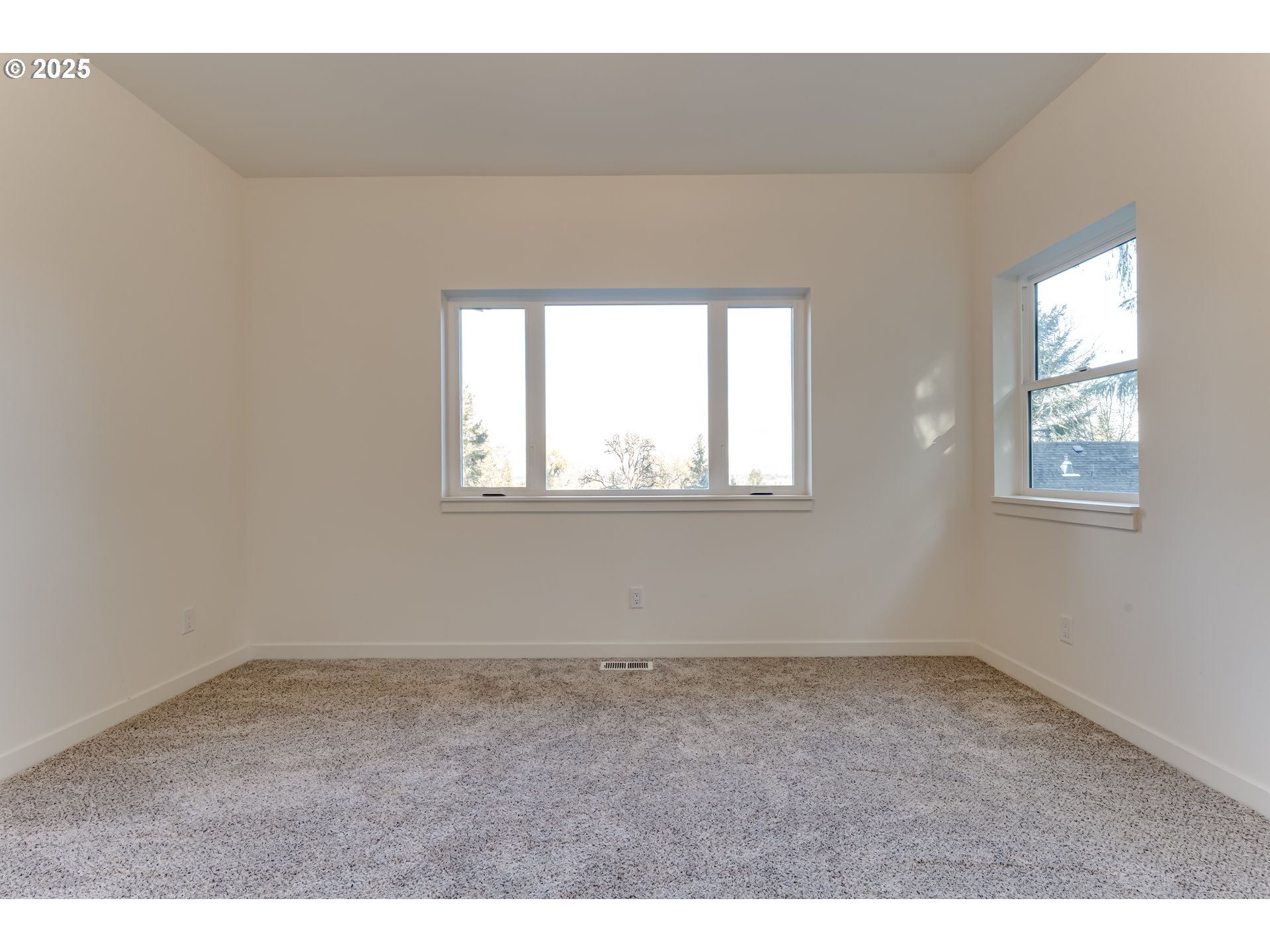 2240 West 25th Place Eugene, OR 97405 - Photo 37 of 48 an empty room with wooden floor and windows