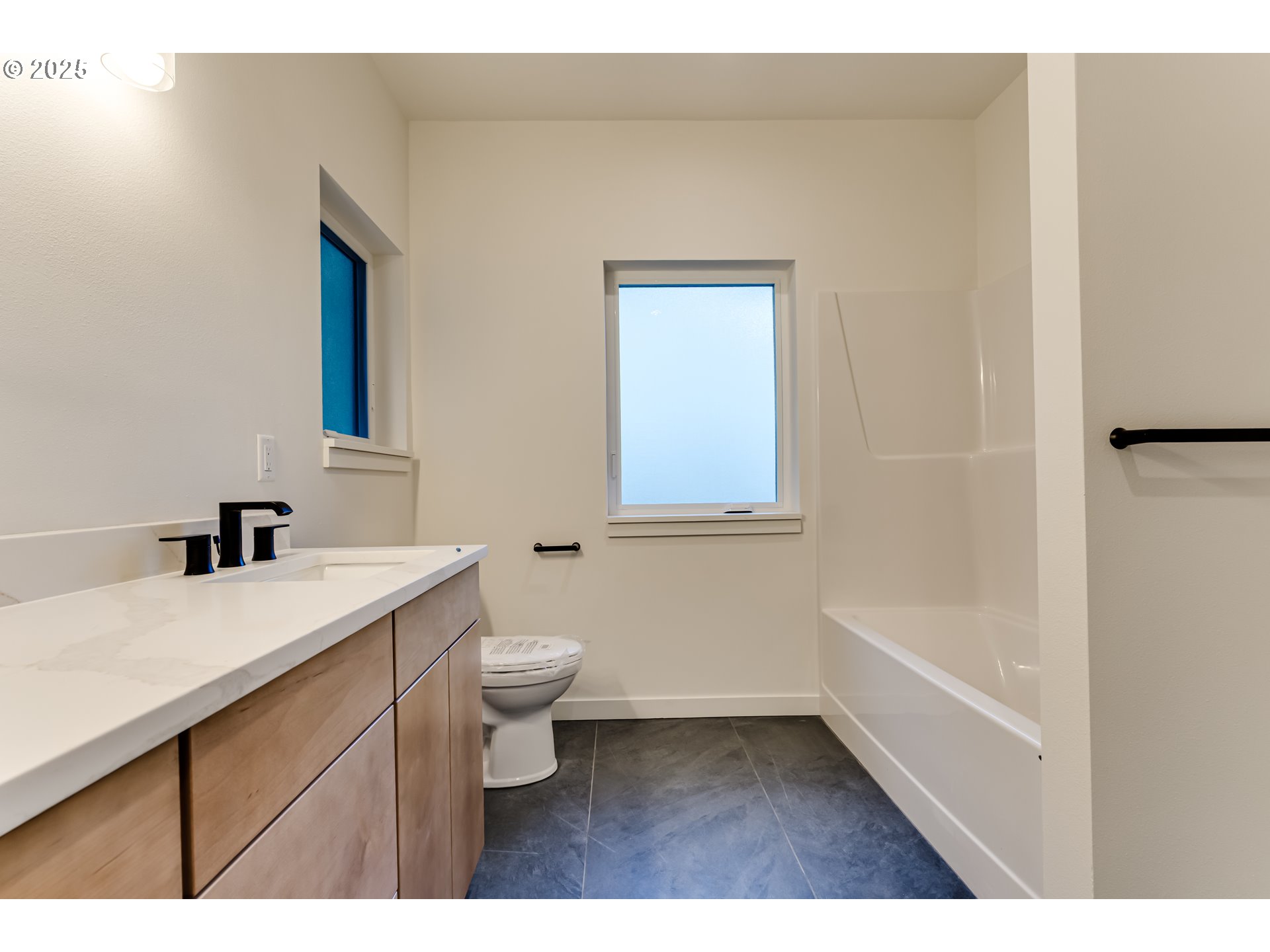 2240 West 25th Place Eugene, OR 97405 - Photo 38 of 48 a bathroom with a sink a toilet and vanity