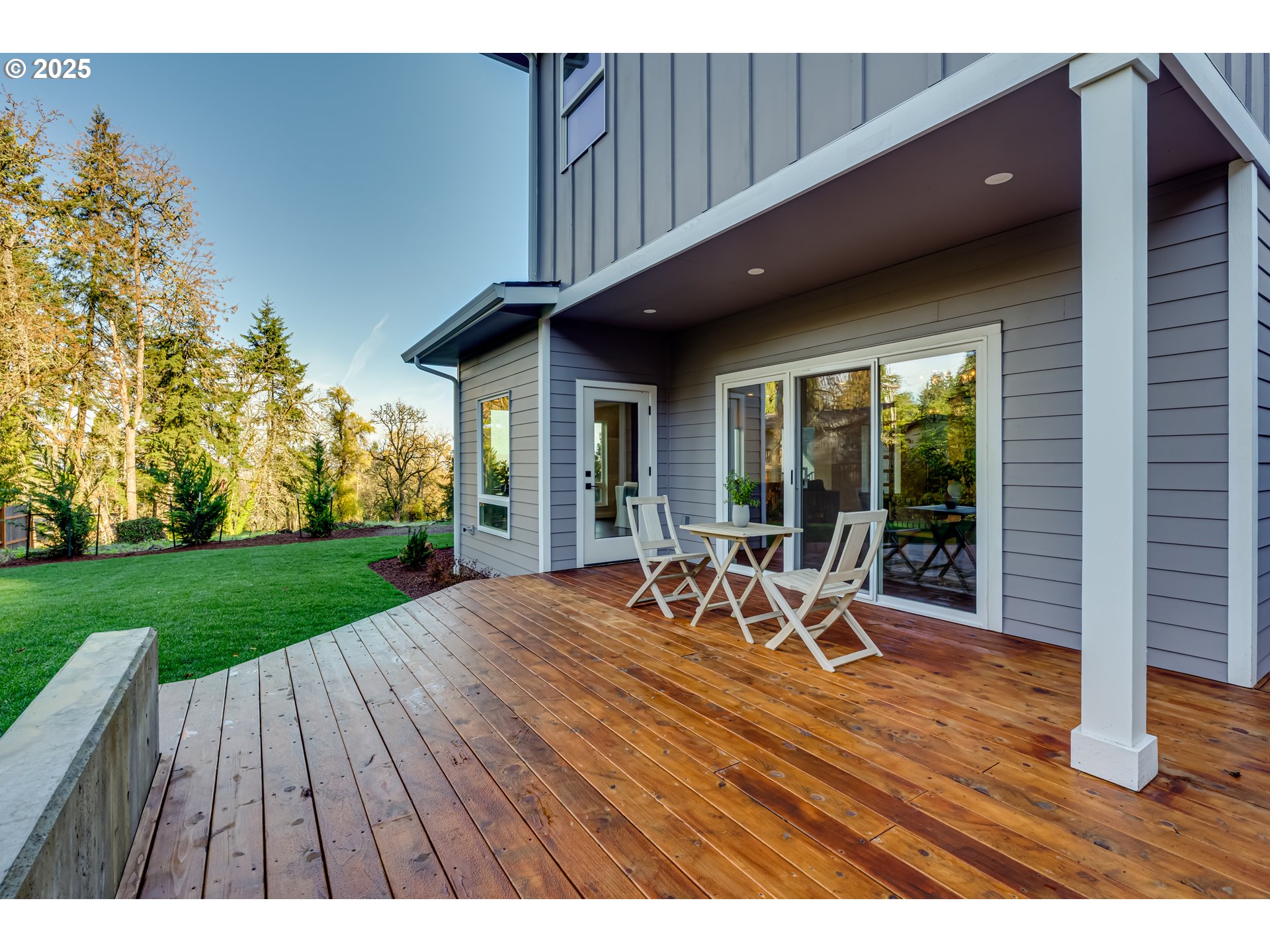 2240 West 25th Place Eugene, OR 97405 - Photo 41 of 48 a view of a patio with table and chairs near a garden