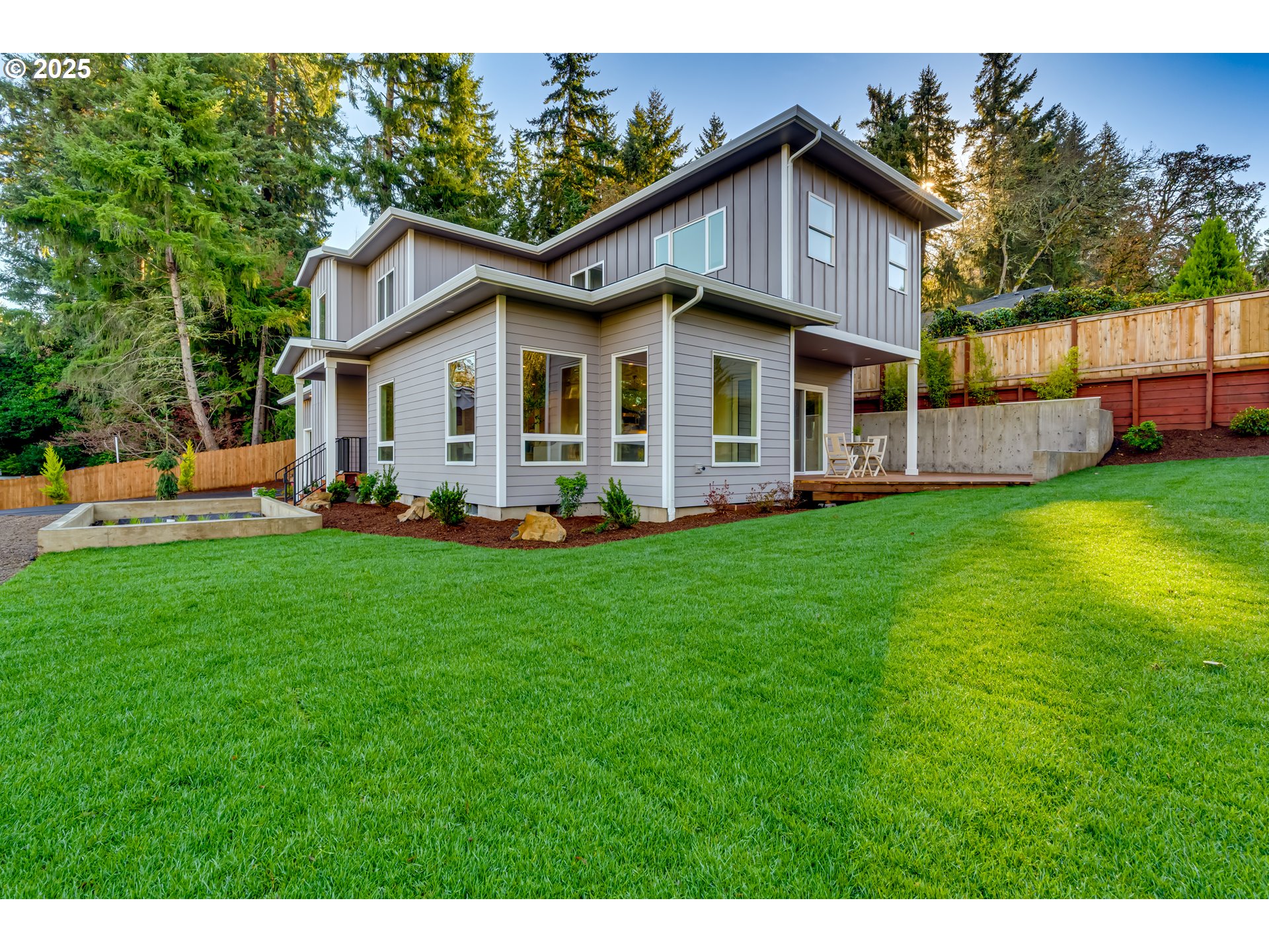 2240 West 25th Place Eugene, OR 97405 - Photo 45 of 48 a view of a house with a big yard and large trees