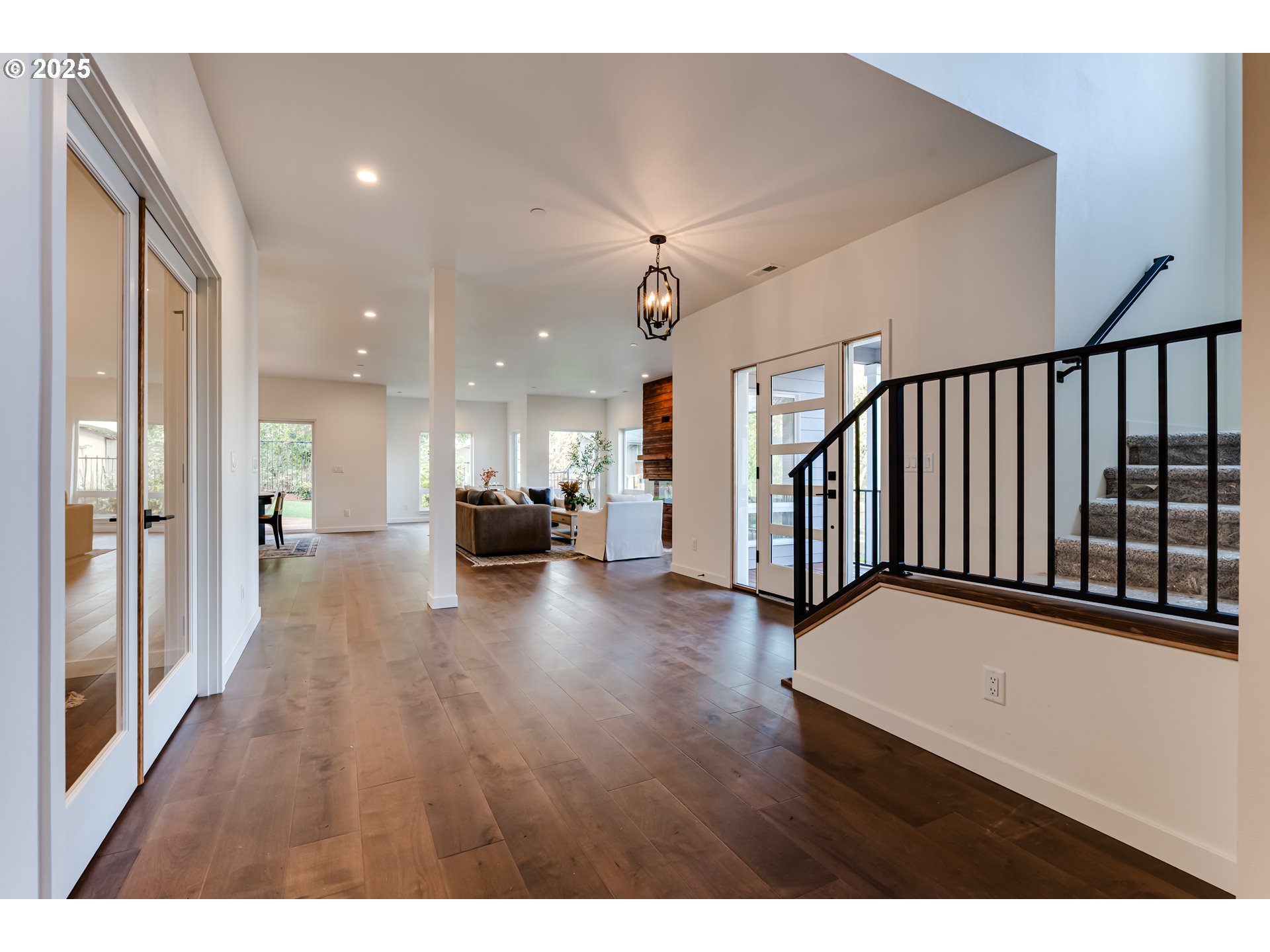 2240 West 25th Place Eugene, OR 97405 - Photo 5 of 48 a view of a hallway with wooden floor and furniture