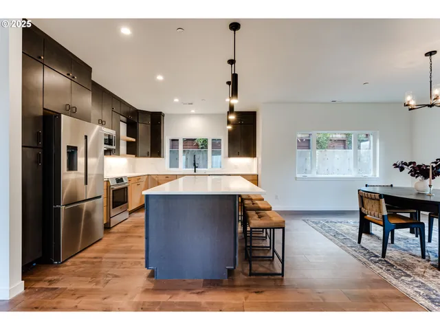 a kitchen with a sink and white cabinets