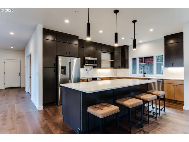 a living room with furniture window and wooden floor