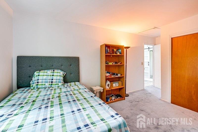 47 Victorian Drive Old Bridge, NJ 08857 - Photo 5 of 10 a bedroom with a bed and a television