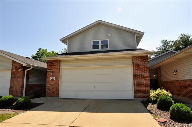 a front view of a house with a garage