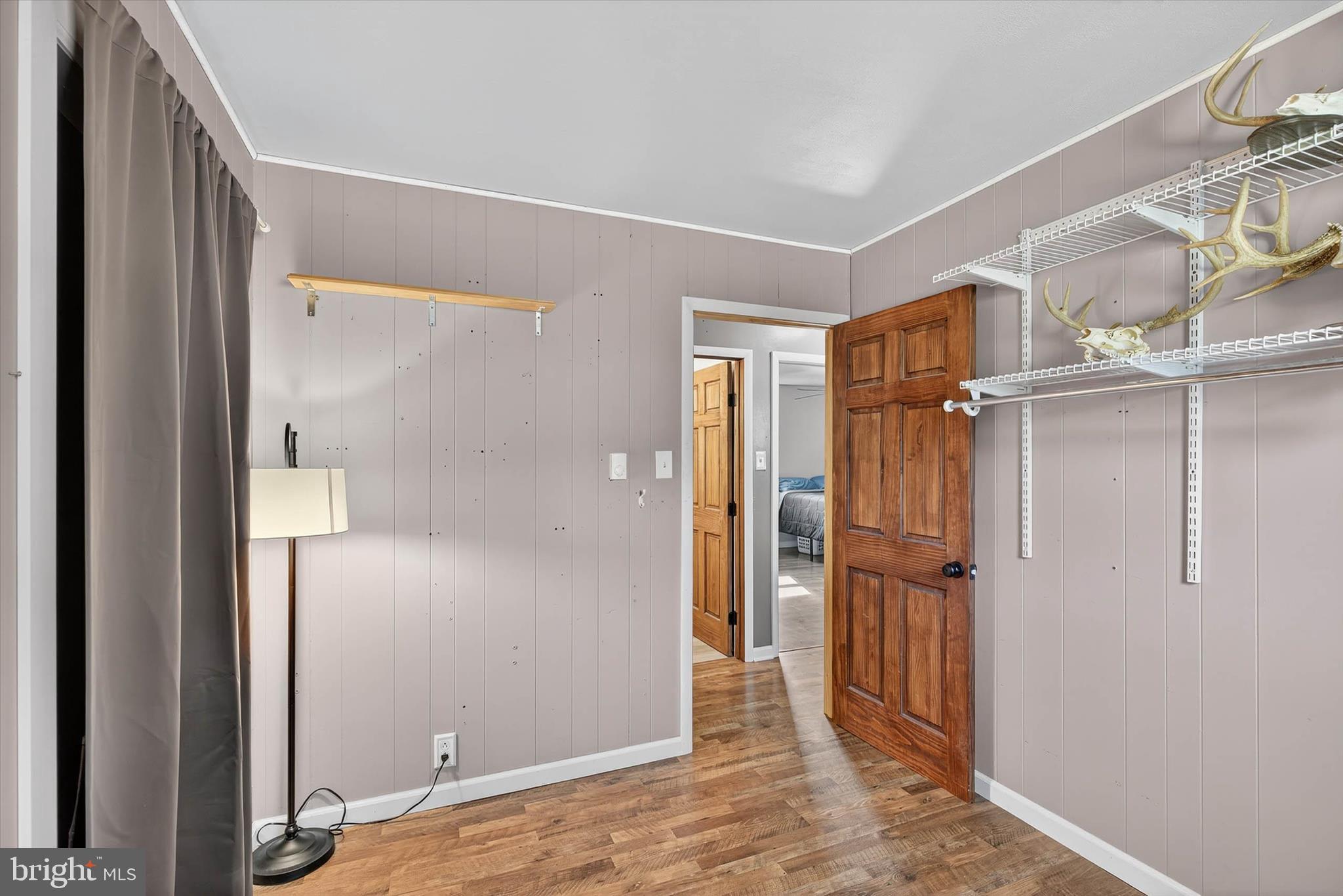 421 Million Dollar Road Halifax, PA 17032 - Photo 21 of 39 a view of a hallway with wooden floor and a bathroom