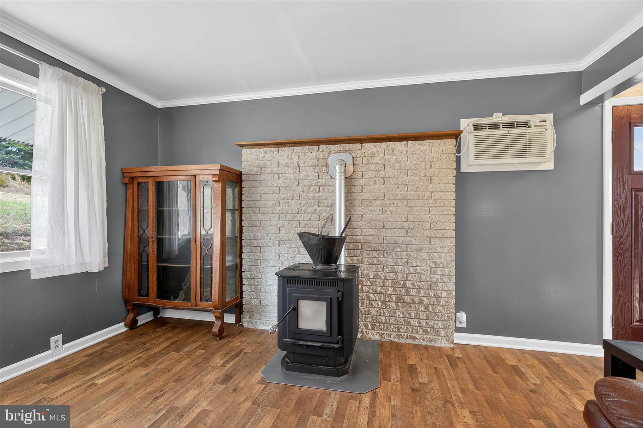 421 Million Dollar Road Halifax, PA 17032 - Photo 7 of 39 a view of a livingroom with wooden floor and a fireplace