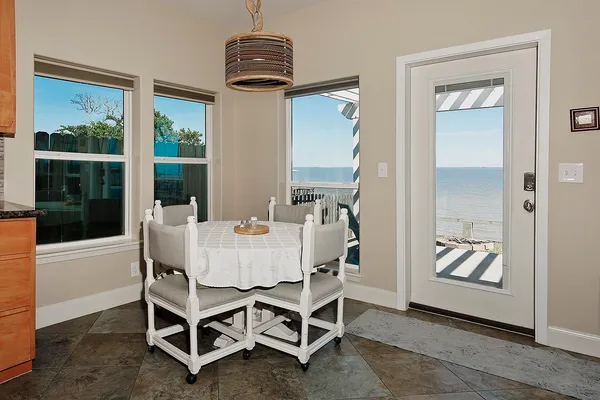 a dining room with furniture and window