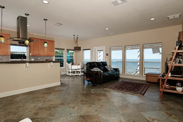 a living room with furniture window and flat screen tv