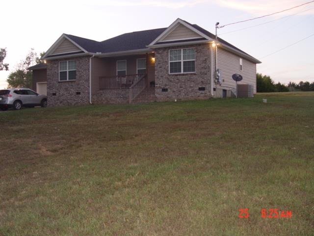 1360 McCool Road Lewisburg, TN 37091 - Photo 1 of 27 a front view of a house with garden