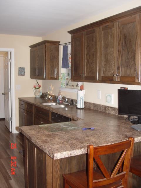 1360 McCool Road Lewisburg, TN 37091 - Photo 11 of 27 a kitchen with kitchen island granite countertop a sink and a counter top space