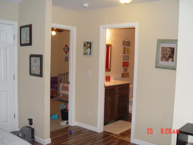 1360 McCool Road Lewisburg, TN 37091 - Photo 13 of 27 workspace with wooden floor and closet