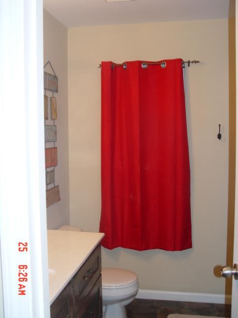 1360 McCool Road Lewisburg, TN 37091 - Photo 14 of 27 a bathroom with a sink a toilet and a mirror