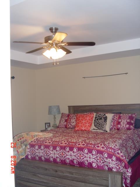1360 McCool Road Lewisburg, TN 37091 - Photo 17 of 27 a bedroom with a bed and a chandelier