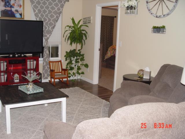 1360 McCool Road Lewisburg, TN 37091 - Photo 8 of 27 a living room with furniture and a flat screen tv