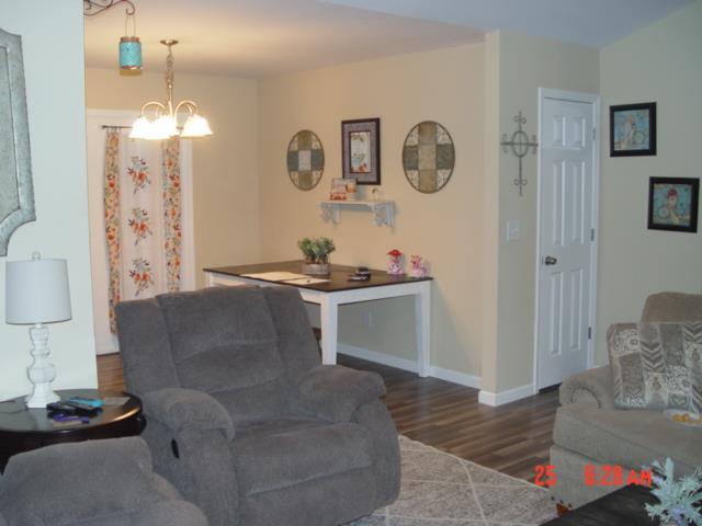 1360 McCool Road Lewisburg, TN 37091 - Photo 9 of 27 a living room with furniture and wall paintings