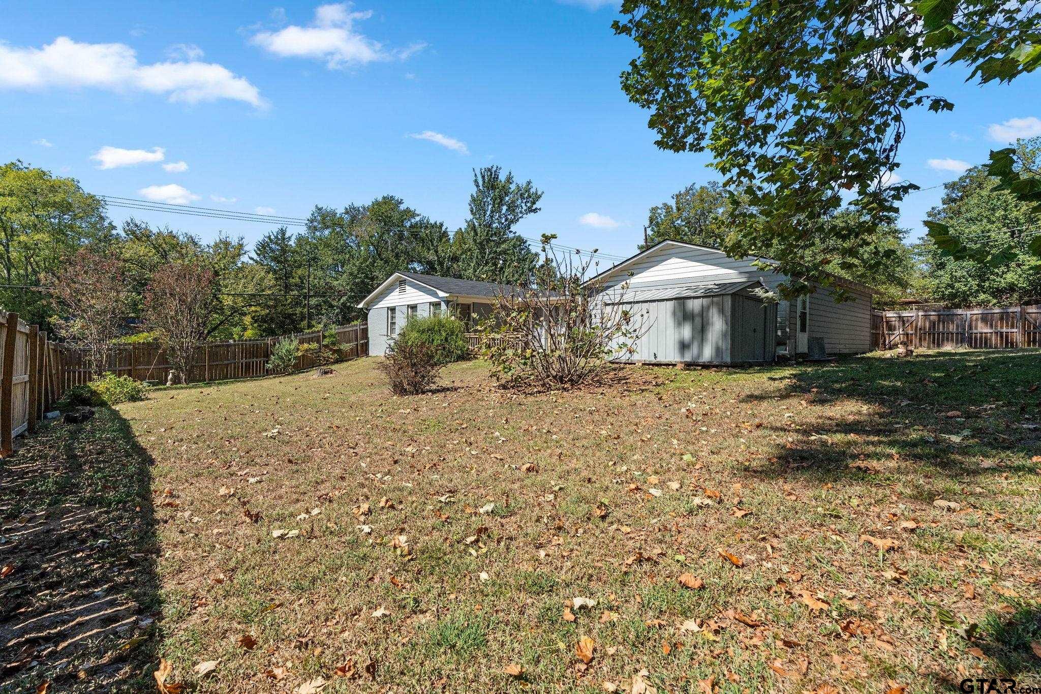 2904 New Copeland Road Tyler, TX 75701 - Photo 24 of 28 a view of a house with a yard