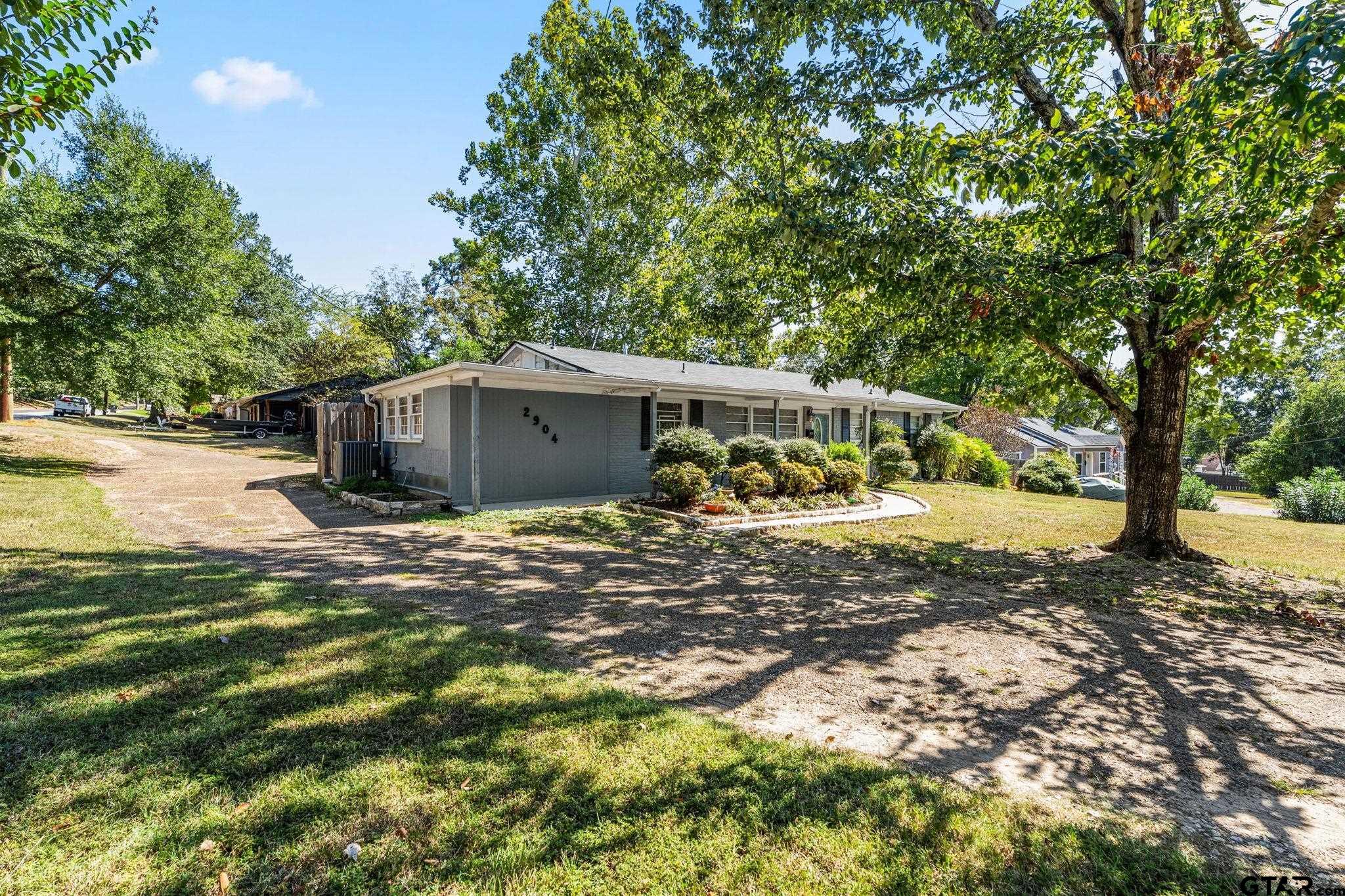 2904 New Copeland Road Tyler, TX 75701 - Photo 27 of 28 a view of a house with a yard