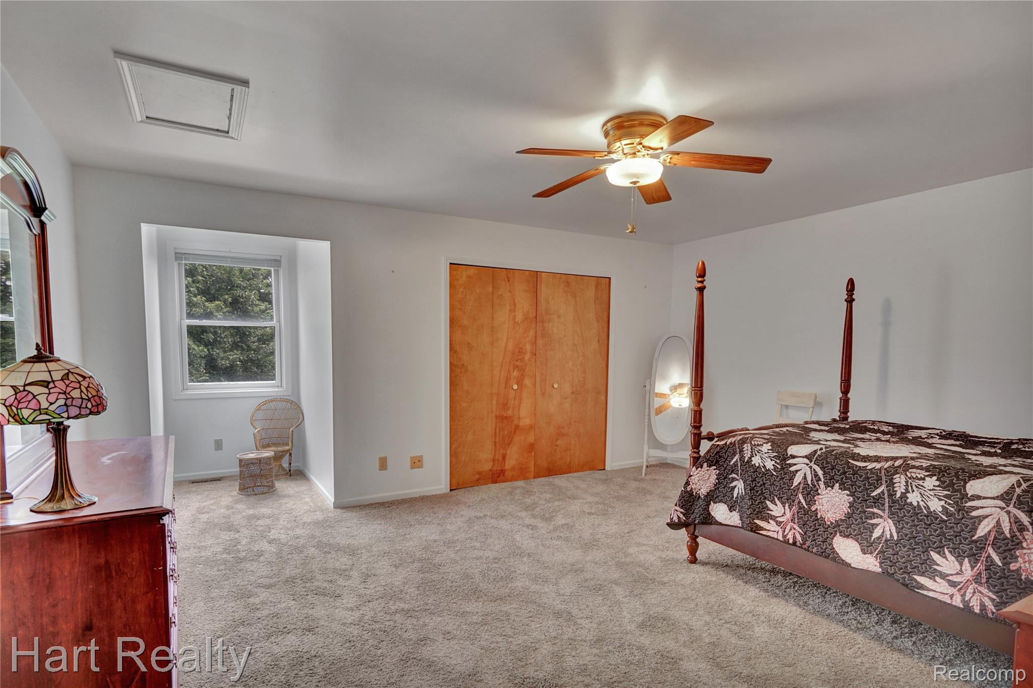 7167 Brown School Road North Branch, MI 48461 - Photo 31 of 51 Carpeted room featuring a ceiling-mounted fan with integrated lighting, a recessed window, and light-toned walls