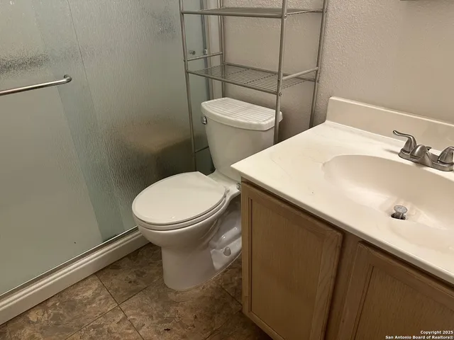 a bathroom with a sink and a toilet