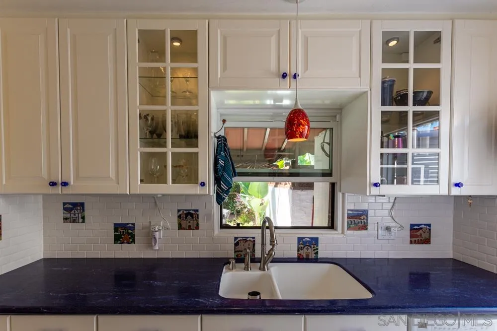 428 G Avenue Coronado, CA 92118 - Photo 6 of 18 a kitchen with a sink cabinets and window