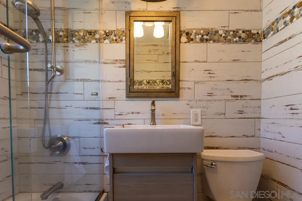 428 G Avenue Coronado, CA 92118 - Photo 8 of 18 a bathroom with a sink toilet and shower