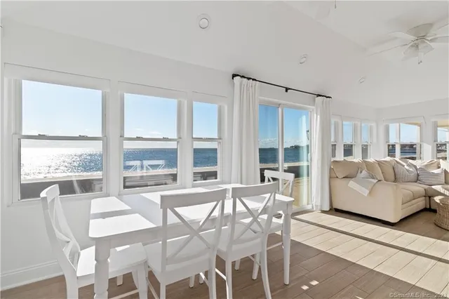 a room with granite countertop a sink and chandelier