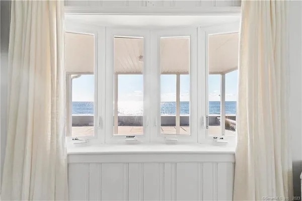 a bedroom with a bed and a night stand