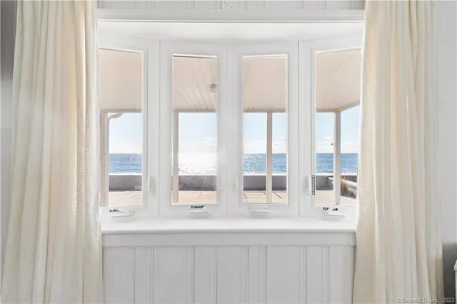 a bedroom with a bed and a night stand