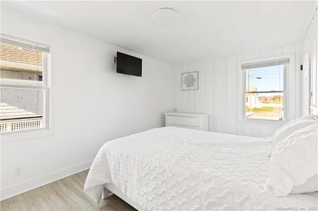 a large white bed in a white room