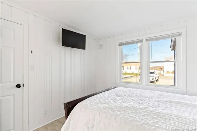 a large bed sitting in a bedroom and dresser