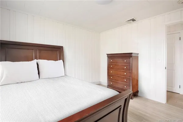 a bedroom with two beds and a window