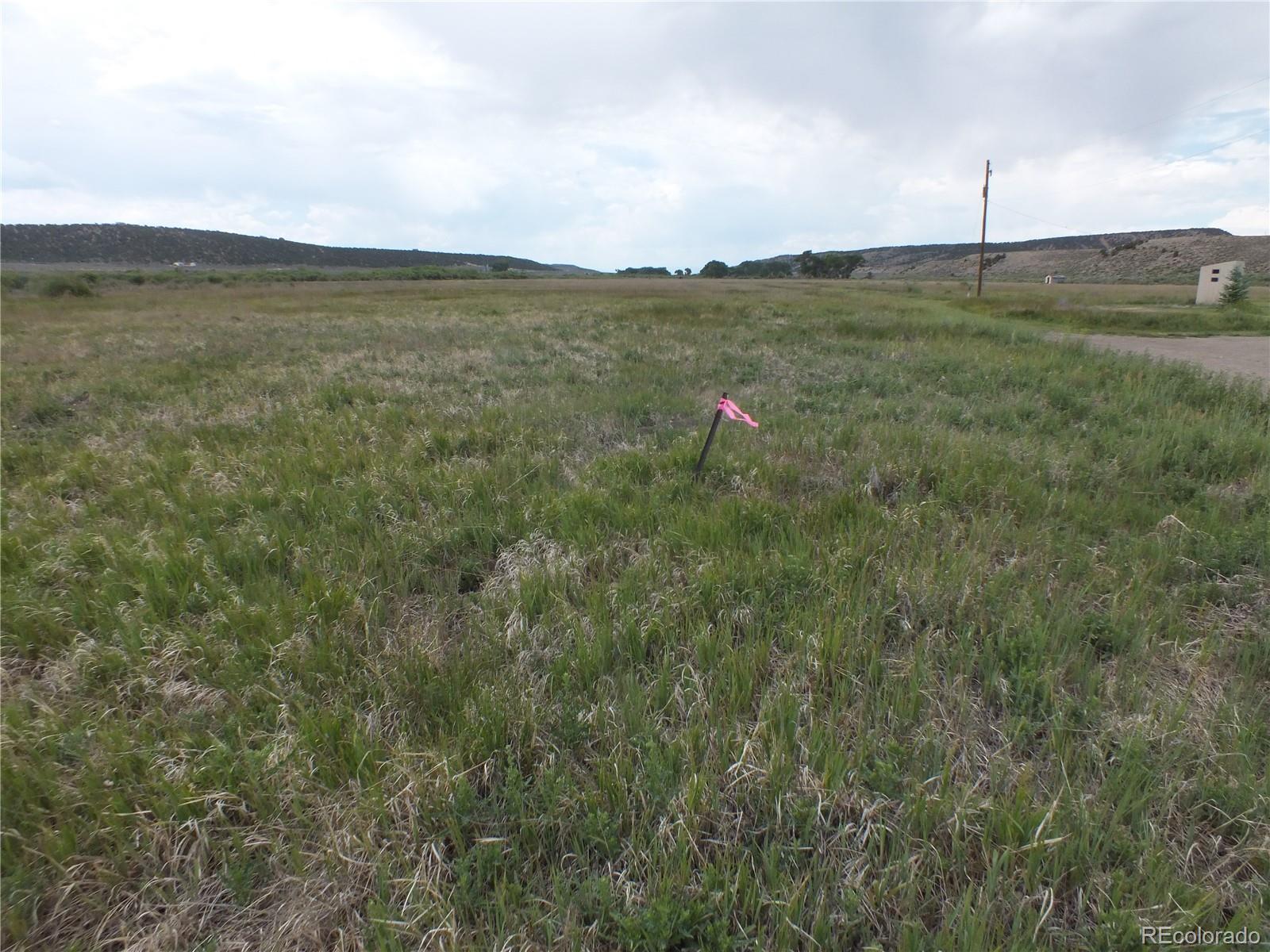 0 Casey Road Fort Garland, CO 81133 - Photo 2 of 11 a view of a green field with an ocean view