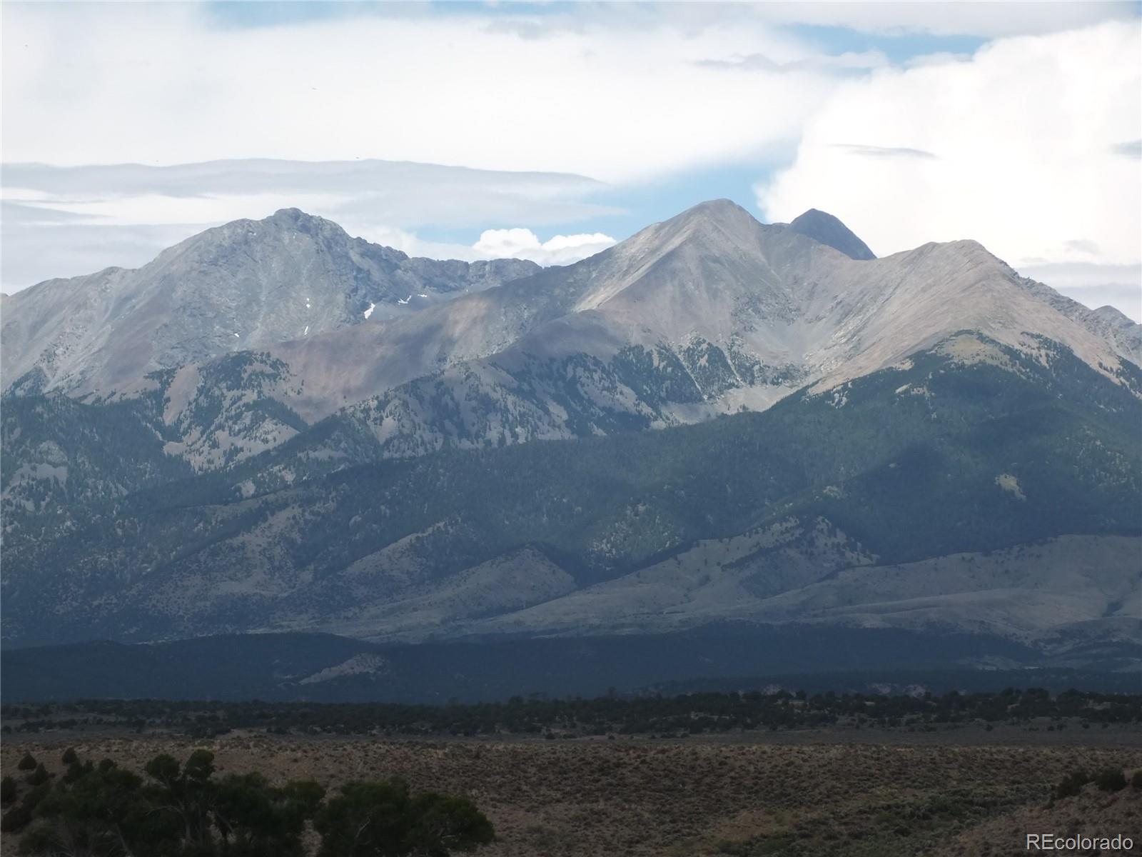 0 Casey Road Fort Garland, CO 81133 - Photo 9 of 11 a view of a yard in front of mountains