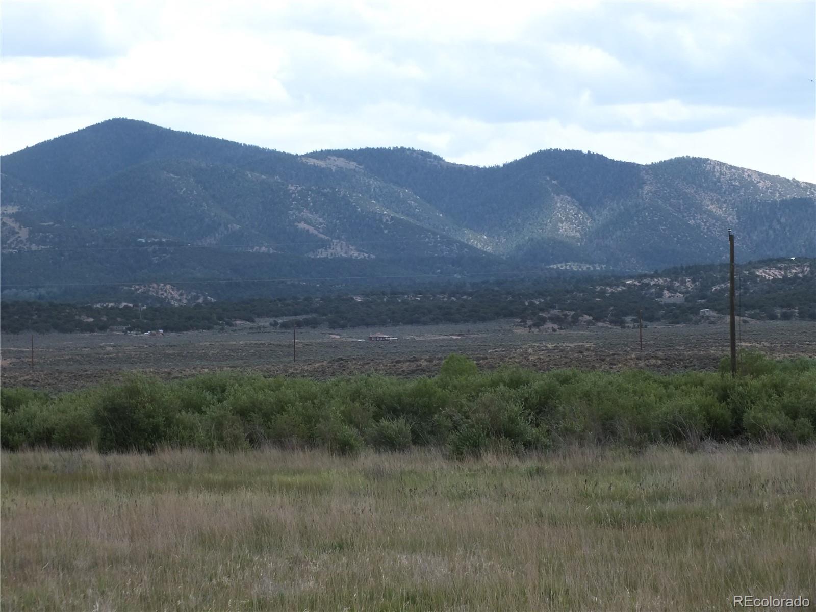 0 Casey Road Fort Garland, CO 81133 - Photo 10 of 11 a view of a town with mountains in the background