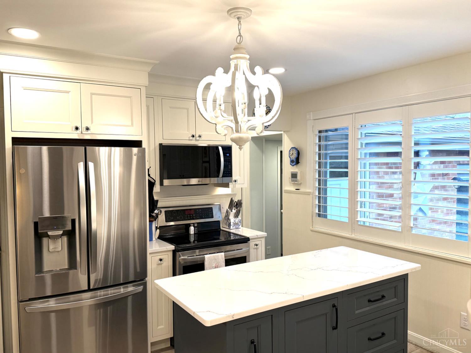 1818 Linneman Road Cincinnati, OH 45238 - Photo 6 of 62 The opening leads to the basement, garage and down the hall to the primary bedroom.