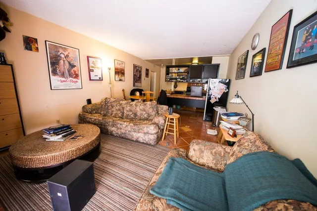 a living room with furniture and next to a window