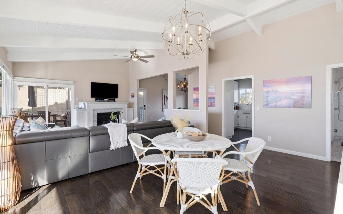 229 Rio Del Mar Boulevard Aptos, CA 95003 - Photo 5 of 27 a view of a dining room with furniture a chandelier and wooden floor