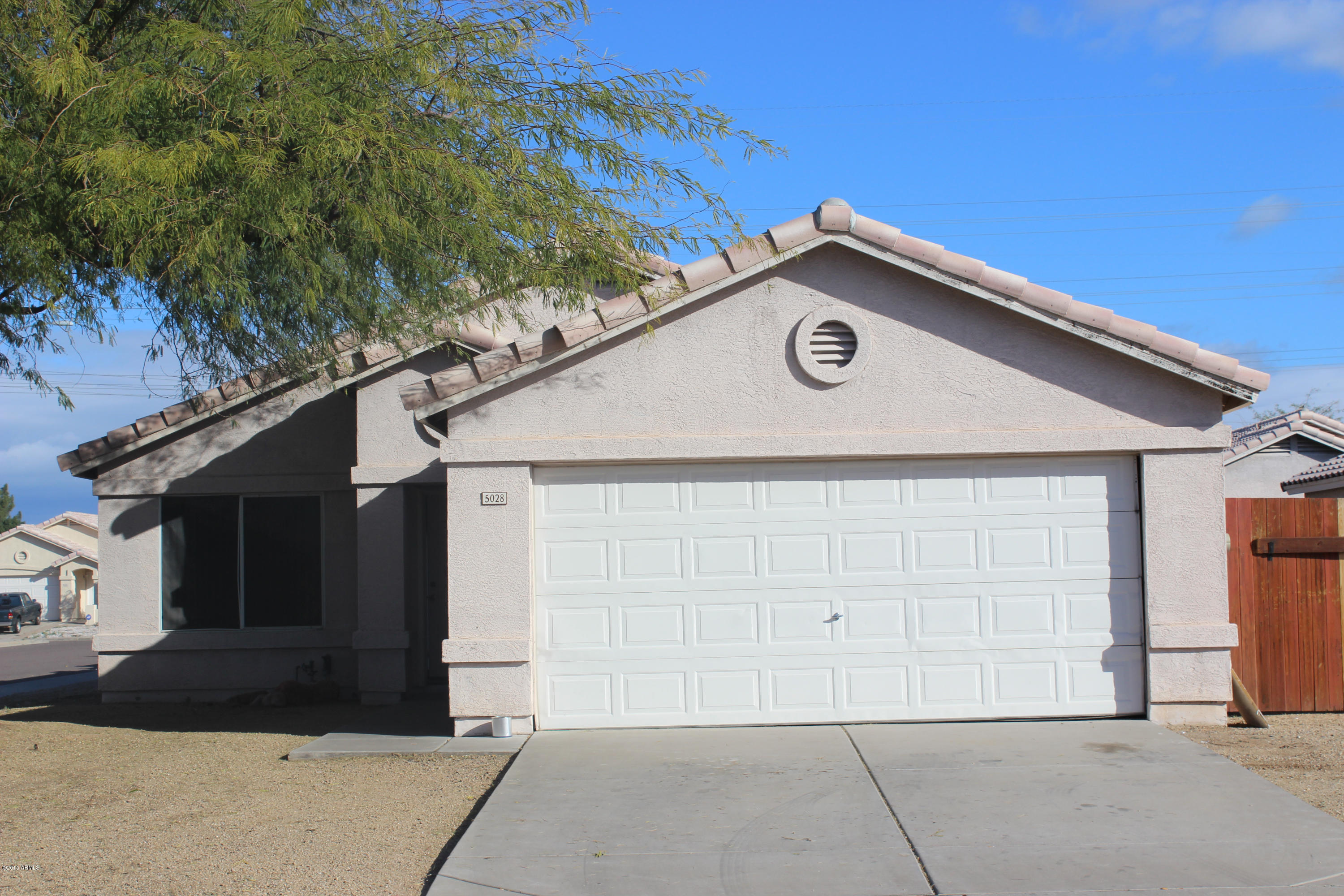 5028 Casper Road Mesa, AZ 85205 - Photo 1 of 33 a house with trees in the background