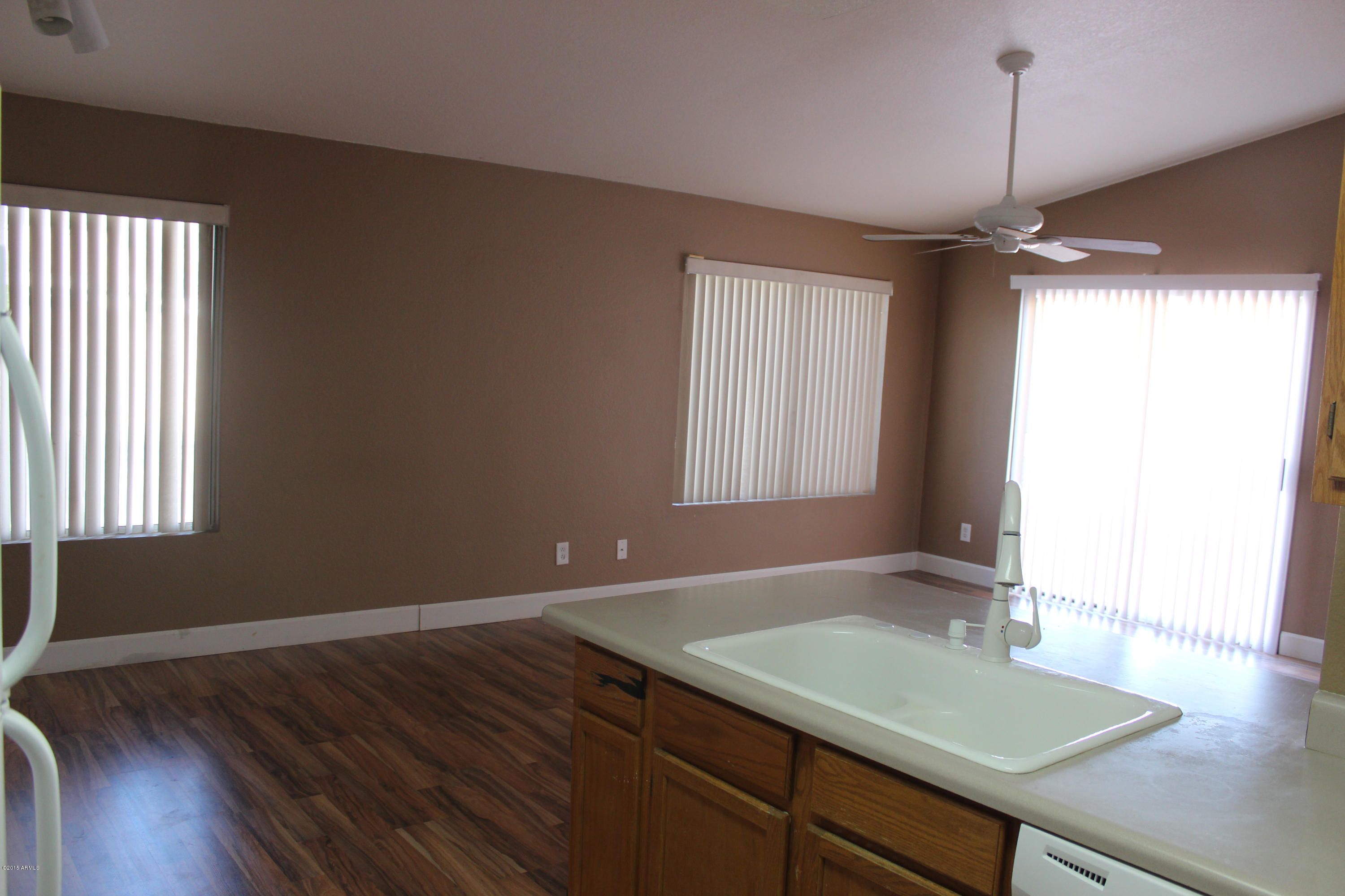 5028 Casper Road Mesa, AZ 85205 - Photo 15 of 33 a room with window and wooden floor